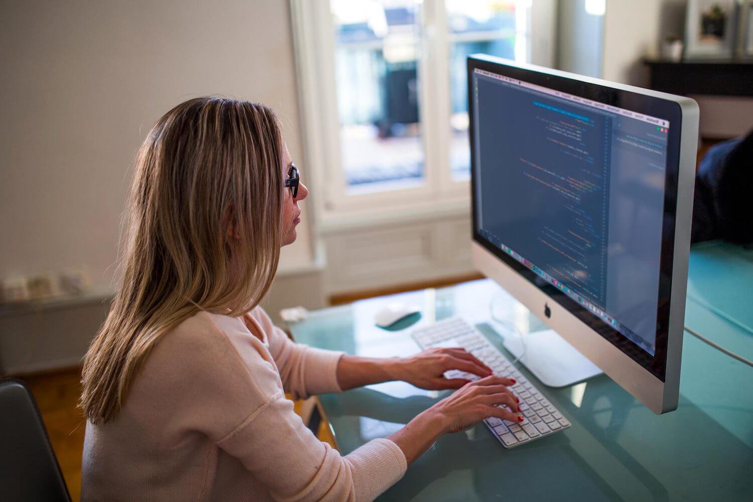 female learning coding at computer